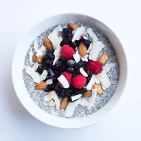 Creamy Poppy Seed Chia Pudding layered with blueberries and toasted almonds for a nutritious breakfast.